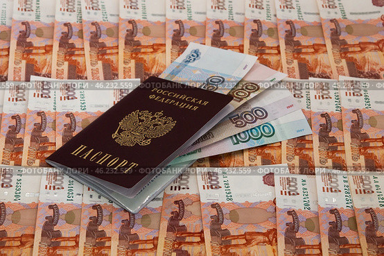 Денежный фон из пятитысячных купюр, купюры 50, 100, 500 и 1000 рублей, российский паспорт / A monetary fund of five thousand banknotes, 50, 100, 500 and 1000 rubles, a Russian passport. Стоковое фото, фотограф Петроченко Мария Петровна / Фотобанк Лори