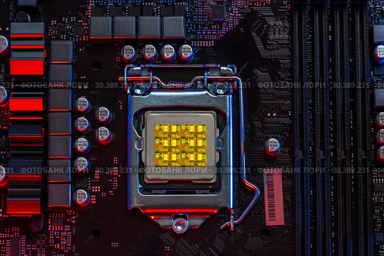 Desktop processor 9th gen on background motherboard closeup (2019 год). Редакционное фото, фотограф Виталий Поздеев / Фотобанк Лори