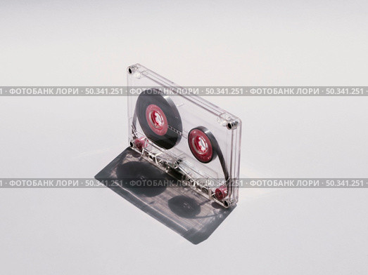 diagonal close up shot clear cassette tape. Стоковое фото, агентство Ingram Publishing / Фотобанк Лори