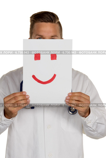 doctor holding smiley face before. Стоковое фото, фотограф Erwin Wodicka / Фотобанк Лори