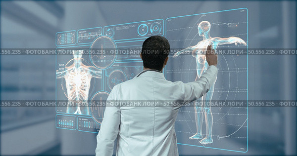 doctor working in laboratory. Studying human skeleton and DNA samples. Стоковое фото, агентство Ingram Publishing / Фотобанк Лори