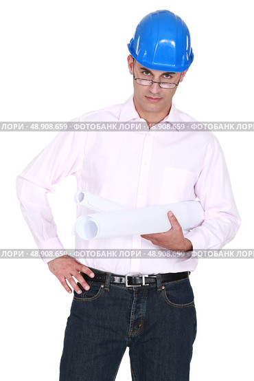 Draughtsman peering over glasses. Стоковое фото, агентство Ingram Publishing / Фотобанк Лори