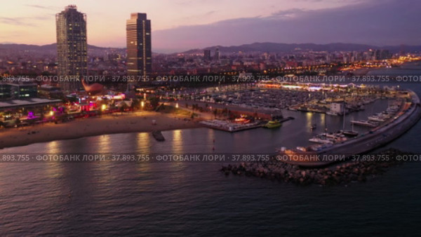 Drone view of the evening Barcelona, the capital of Catalonia, on the Mediterranean coast, Spain. Стоковое видео, видеограф Яков Филимонов / Фотобанк Лори