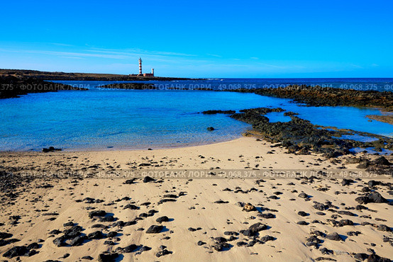 El Cotillo beach and Toston lighthouse at Fuerteventura Canary Islands. Стоковое фото, агентство Ingram Publishing / Фотобанк Лори