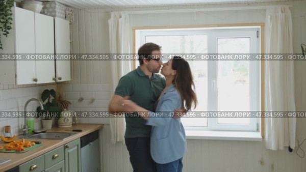 Emotional Dance. Middle-aged Couple Dancing Together Embrace at Home. Mature Couple dancing bonding, smiling and moving to the rhythm in a romantic vibe enjoying their anniversary. Active relationship. Стоковое видео, видеограф Марина Демидюк / Фотобанк Лори