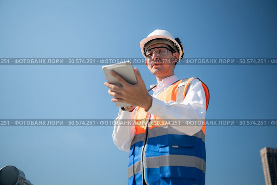 Engineers inspect the completed air conditioning and water systems to continue verifying their functionality. Стоковое фото, агентство Ingram Publishing / Фотобанк Лори