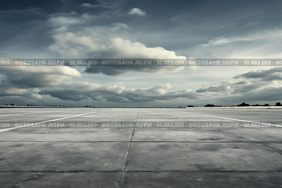Expansive concrete surface under dramatic sky. Стоковое AI-изображение, AI-художник Иван Рябоконь / Фотобанк Лори