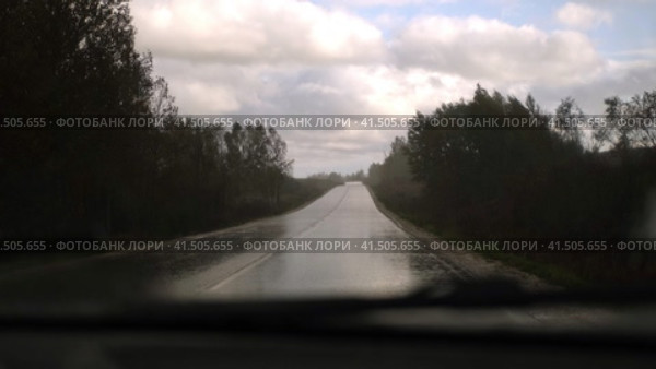Extreme Driving during heavy downpour storm. Selective focus. POV of car windscreen. Dangerous wet asphalt road trip. Bad visibility. Moving windshield wiper vehicle. Traffic at Rainfall. Travel blog. Стоковое видео, видеограф Марина Демидюк / Фотобанк Лори