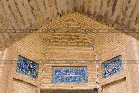 Facade of old Madrasah in Itchan Kala, the walled inner town of the city of Khiva. Стоковое фото, фотограф Юлия Белоусова / Фотобанк Лори