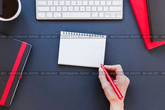 faceless person writing notebook near coffee cup keyboard. Стоковое фото, агентство Ingram Publishing / Фотобанк Лори