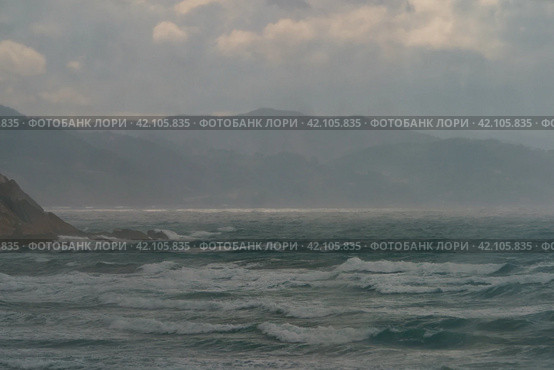 Fantastic picturesque seascape of Itzurun beach in Zumaia in Basque Autonomous Community  country in summer day. Concept of the beauty in nature. Noise of the ocean in the image. Стоковое фото, фотограф YuryKara / Фотобанк Лори