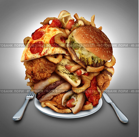 Fast food diet concept served on a plate as a mountain of greasy fried restaurant take out as onion rings burger and hot dogs with fried chicken french fries and pizza as a symbol of compulsive overeating and dieting temptation resulting in unhealthy nutrition. Стоковое фото, агентство Ingram Publishing / Фотобанк Лори