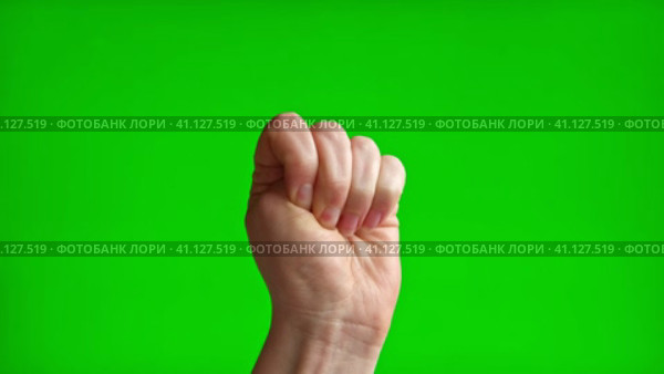 Female Hand with Beige Manicure making Rise Up Sign Symbol with her Fist. Chroma key Green Screen Background. Gestures Movements. Body Language. 4K Footage. Close Up. Raised hand with clenched fist. Стоковое видео, видеограф Марина Демидюк / Фотобанк Лори