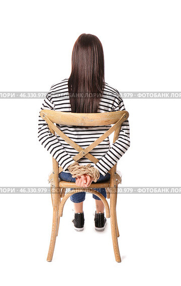 Female hostage sitting on chair against white background. Стоковое фото, фотограф Pixel_shot / Фотобанк Лори