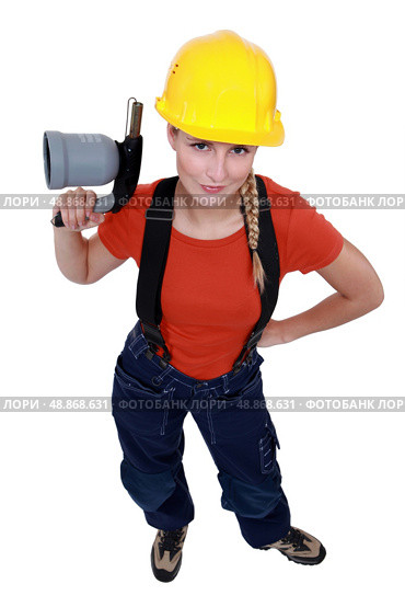 Female laborer holding blowtorch. Стоковое фото, агентство Ingram Publishing / Фотобанк Лори