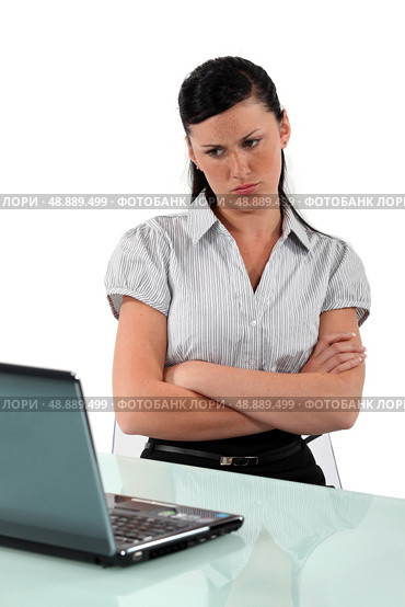 Female office worked looking annoyed. Стоковое фото, агентство Ingram Publishing / Фотобанк Лори