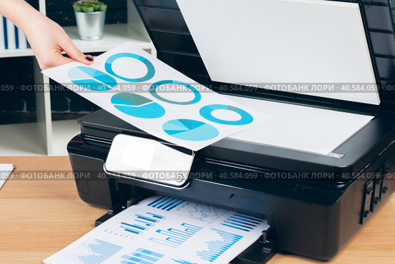 Female secretary making photocopies on xerox machine in office. Стоковое фото, фотограф Сергей Толмачёв / Фотобанк Лори