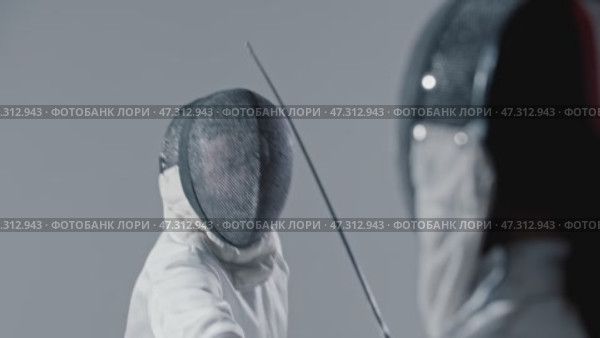 Fencing - two young women fencers having a training fight. Стоковое видео, видеограф Константин Шишкин / Фотобанк Лори