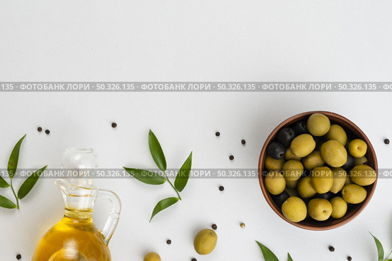 flat lay olives bowl oil bottle. Resolution and high quality beautiful photo. flat lay olives bowl oil bottle. High quality beautiful photo concept. Стоковое фото, агентство Ingram Publishing / Фотобанк Лори