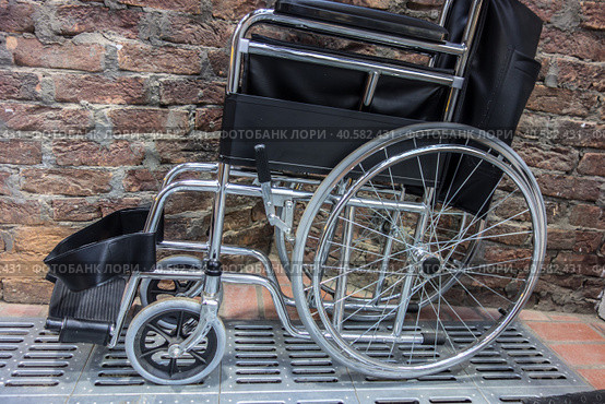 Folded wheelchair. Public toilet. Стоковое фото, фотограф Iva Noel / Фотобанк Лори