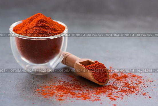 Fragrant spices. Paprika on a gray background. Free space for text. Стоковое фото, фотограф Photojuli / Фотобанк Лори