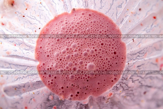 Fresh strawberries with yoghurt in glass blender mixing together. Top view of cocktail or smoothies preparing.. Freshly made strawberries smoothie with chia seeds in blender cup, top view. Стоковое фото, агентство Ingram Publishing / Фотобанк Лори