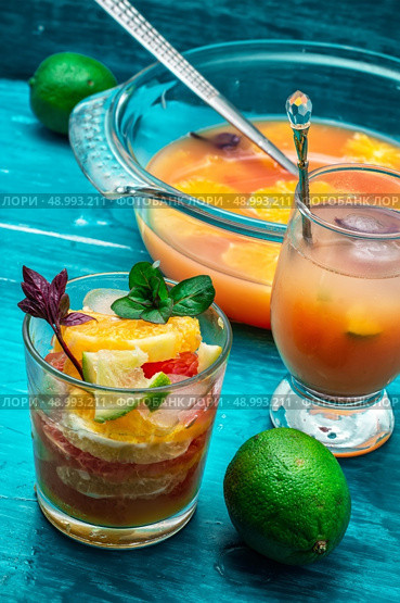 fresh tropical fruit juices. glass with drink of freshly squeezed tropical fruit with pulp.Selective focus.Photo tinted. Стоковое фото, агентство Ingram Publishing / Фотобанк Лори