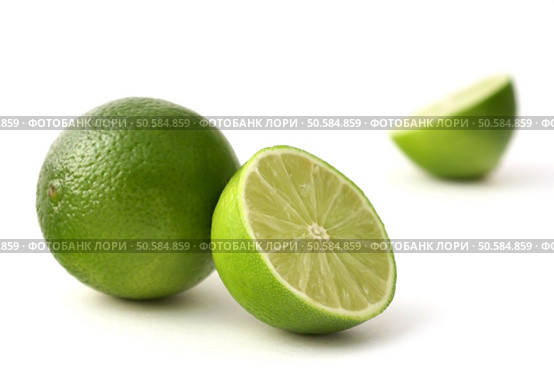 freshly cut limes on a white back ground. Стоковое фото, агентство Ingram Publishing / Фотобанк Лори