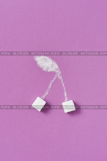 Fruit composition handmade from sweet pressed and granulated sweet sugar cherry berries on a purple background with copy space. Flat lay.. Cherry berries handmade from granulated and refined sweet sugar. Стоковое фото, агентство Ingram Publishing / Фотобанк Лори