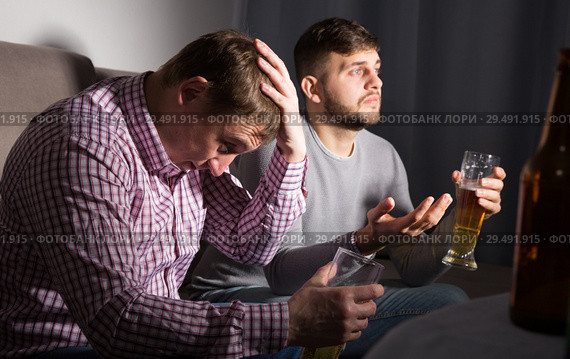 Frustrated men watching matchup on tv. Стоковое фото, фотограф Яков Филимонов / Фотобанк Лори