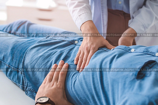 Gastroenterologist examining man in clinic. Стоковое фото, фотограф Pixel_shot / Фотобанк Лори