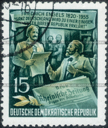 Germany, GDR - circa 1955: stamp dedicated to the 60th anniversary of the death of Friedrich Engels. Karl Marx. Newspaper, circa 1955. Стоковое фото, фотограф Константин Тимофеев / Фотобанк Лори