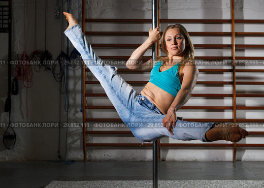 Girl engaged on pylon in semidarkness. Стоковое фото, фотограф Яков Филимонов / Фотобанк Лори