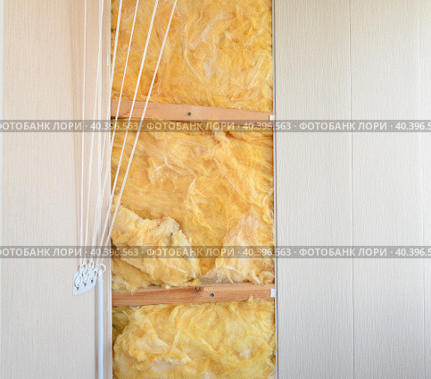 Glass wool - the thermal insulation material under PVC panels. Стоковое фото, фотограф Володина Ольга / Фотобанк Лори