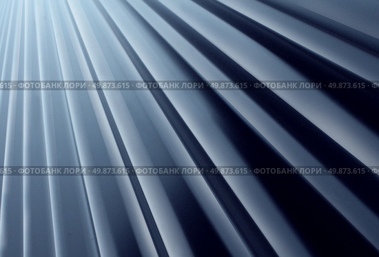Glossy Metal Radial background made of painted curved aluminum sheet steel looking up as a construction design element for modern architecture and new age outdoor building material. Стоковое фото, агентство Ingram Publishing / Фотобанк Лори