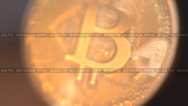 Gold Bitcoin Symbol beautifully placed on a Wooden Surface. Close up. Стоковое видео, видеограф Степанов Григорий / Фотобанк Лори