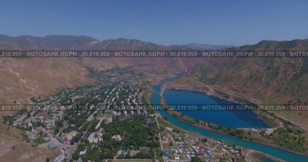 Город Нурек, плотина, водохранилище. Вид с дрона. Таджикистан (2016 год). Стоковое видео, видеограф Евгений Ковалев / Фотобанк Лори