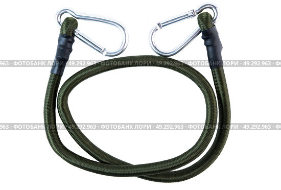 Green bungee cord with metal carabiner hooks at both ends, laid in a circular shape on a white background. Heavy-duty elastic rope for securing gear. Стоковое фото, фотограф Татьяна Терехина / Фотобанк Лори
