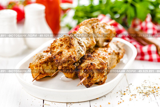Grilled meat skewers, shish kebab on white background. Стоковое фото, агентство Ingram Publishing / Фотобанк Лори