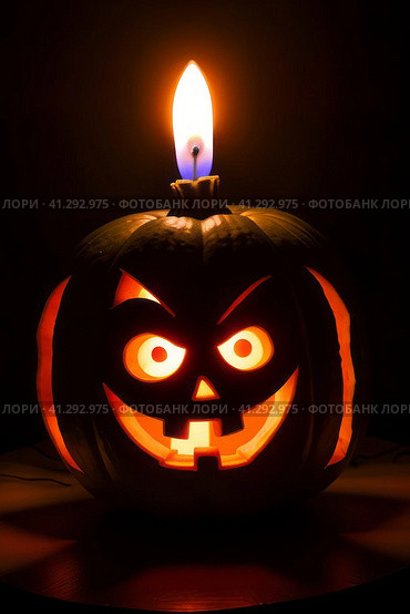 Halloween - annually October 31. One of the most famous attributes is the pumpkin lantern, or Jack's lamp — it is a hollow pumpkin, on which an ominous grimace is carved, and a candle is placed inside. Стоковое AI-изображение, AI-художник Сергей Елизарьев / Фотобанк Лори