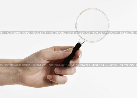 hand holding magnifying glass. Стоковое фото, агентство Ingram Publishing / Фотобанк Лори