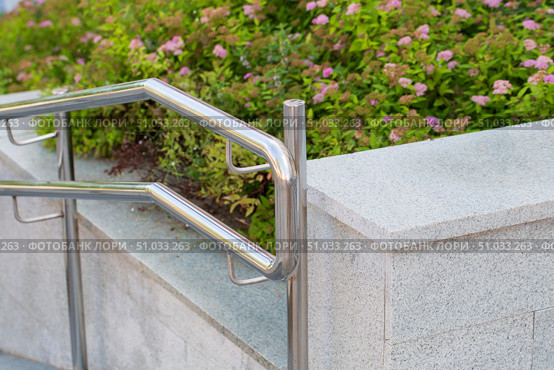 Handrails for helping you climb stairs made of stainless steel. Стоковое фото, фотограф Александр Поташев / Фотобанк Лори