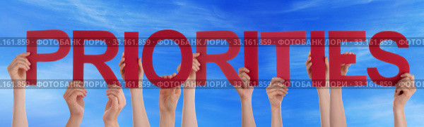 Hands Hold Red Straight Word Priorities Blue Sky. Стоковое фото, фотограф Nadja Blume / PantherMedia / Фотобанк Лори