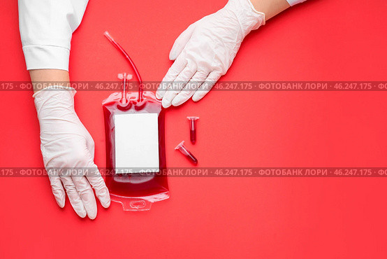 Hands of doctor with blood pack for transfusion and test tubes on color background. Стоковое фото, фотограф Pixel_shot / Фотобанк Лори