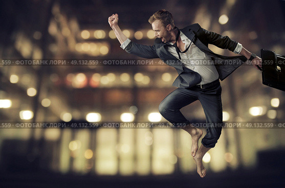 Handsome and young businessman achieving a success. Стоковое фото, агентство Ingram Publishing / Фотобанк Лори