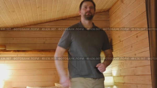 Handsome bearded man dance, have fun at home listens song, moves to music, feels overjoyed, celebrate good news, relish carefree life looks happy. Young adult male twirls, grooves. Brutal man dancer. Стоковое видео, видеограф Марина Демидюк / Фотобанк Лори