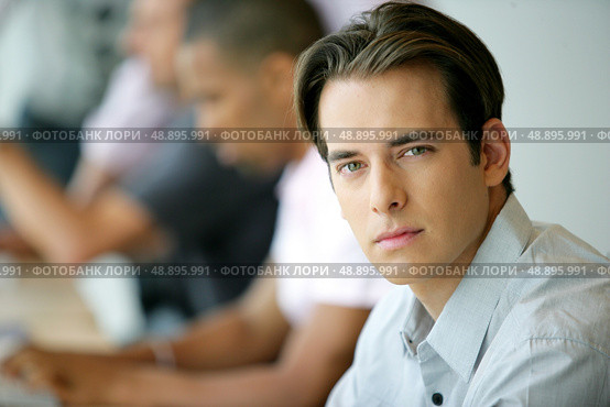 Handsome young man in an office environment. Стоковое фото, агентство Ingram Publishing / Фотобанк Лори