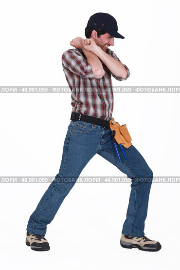 Handyman pulling an invisible object. Стоковое фото, агентство Ingram Publishing / Фотобанк Лори