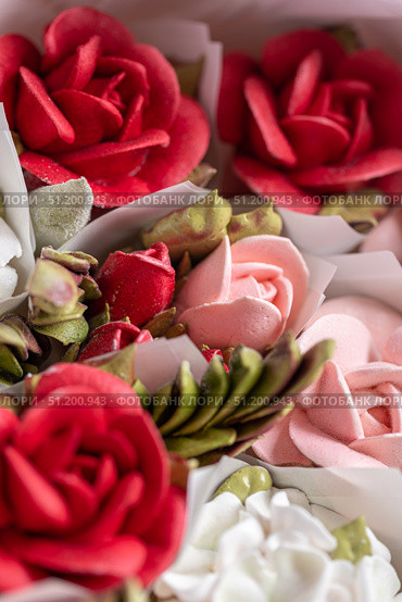 Home-made zephyr floristry featuring vibrant red and pink floral designs, showcasing intricate details and textures, perfect for celebrations and decorative purposes. Стоковое фото, фотограф Ирина Ручушкина / Фотобанк Лори