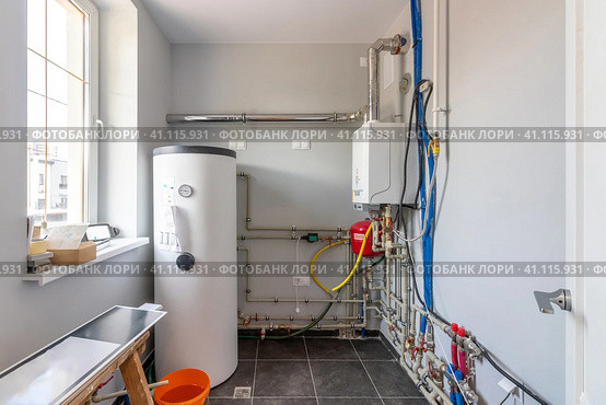 Hot water boiler. Boiler room with a heating system. Стоковое фото, фотограф Дмитрий Головач / Фотобанк Лори